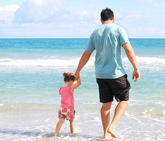 Father and daughter on beach for visitation
